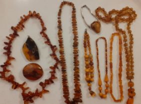 A quantity of mid to late 20th Century amber costume jewellery to include orange, butterscotch and