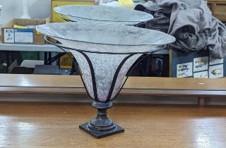 A large glass and iron centrepiece having trumpet shaped Art Glass bowl, within supported wrought