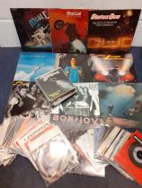 A small quantity of Heavy Metal and Rock LP's and 45rpm singles to include Meat Loaf, Bon Jovi and