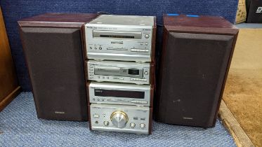 A Technics stereo stacking system with two speakers. Location:G
