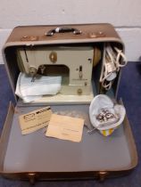 A mid 20th Century Bernina electric sewing machine in case with leads and accessories. Location:RWM