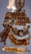 A quantity of vintage fur wraps, collars, insertions and remnants to include a wolf stole, a fox