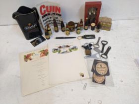 Guinness advertising collectables to include miniature beer bottles, a retirement menu, bottle