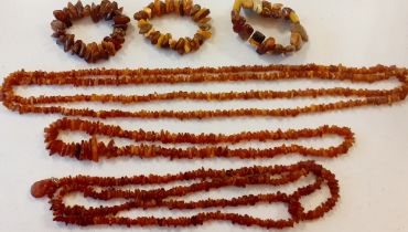 Three vintage rough cut amber necklaces, one having a teardrop pendant on gold tone links and 2