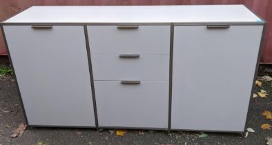 A Ligne Roset Dita modern sideboard having three drawers flanked by two cupboard doors 87h x 163.