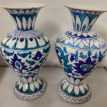 A pair of late 19th century/early 20th century Islamic vases decorated in blue and green Location: