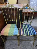 A pair of gilt metal chairs with stripped upholstered seats Location: