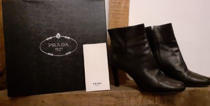 Prada- Circa 2015, a pair of 'Calzature Vitello Nero 39' ladies black leather ankle boots, as new,