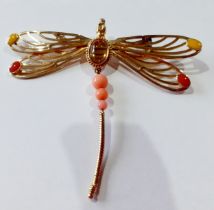 Lalique- A silver gilt dragonfly brooch having 2 red and 2 yellow coloured cabochons to the wings, a