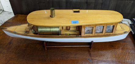 A wooden built model boat with fitted boiler Location: