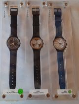 Swatch- A group of 3x 1990's chronograph watches in freestanding display stands comprising 'Black