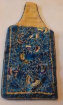 An early 20th Century hand embroidered Chinese hot water bottle cover A/F on a gold coloured