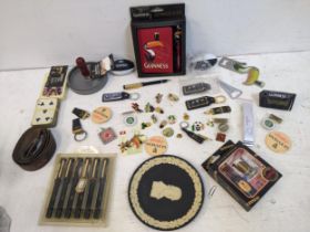Guinness advertising collectables to include badges, pens, playing cards, bottle openers, a Wedgwood