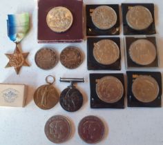 A small quantity of coins and early 20th Century medals to include 2 silver 1966 Canadian dollars