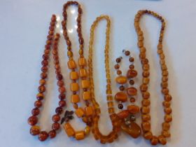 Five vintage necklaces to include butterscotch amber. Location:R1.4