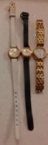 Three ladies cocktail watches to include a gold tone Raymond Weil watch, a Tissot watch on a cream
