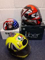 Three decorative helmets to include Skid Lid and Uber for decoration only, all with original