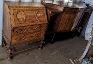 An early 2th century oak bureau having a fall flap above two drawers 99h x 73 together with an