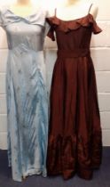 Two mid 20th Century evening gowns, one in baby blue with floral sprays and a shawl neckline, the