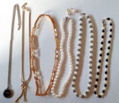 Six necklaces to include a simulated pearl and blue bead necklace having a 9ct gold clasp stamped