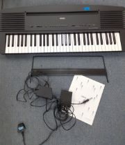 A Yamaha YPR-30 electric piano keyboard with leads and manual. Location:G