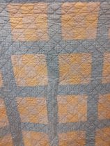 A mid 20th Century American Mid West double layer handmade patchwork quilt in mustard yellow,