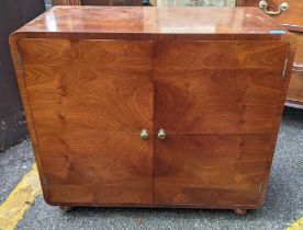 An early/mid 20th century walnut veneered cocktail cabinet Location: