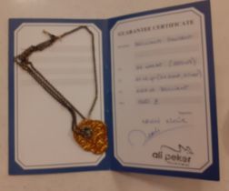 A Turkish silver gilt pendant, 24ct gold plate on silver, on an open link chain with certificate.