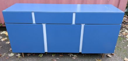 A Ligne Roset modern blue lacquered finished sideboard having three drawers above three cupboard