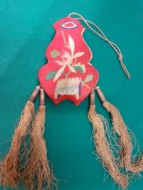 An early 20th Century Chinese silk embroidered snuff bottle pouch with 4 tassels. Location:RAB