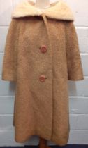 A mid 20th Century American B.Forman & Co tan boucle lambswool swing ladies coat having an arctic