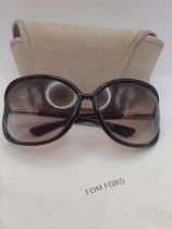 Tom Ford-A pair of brown framed sunglasses with brown ombre lenses and gold tone temples, Model '