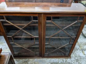 A 19th century mahogany bookcase with twin astragal glazed doors, three adjustable shelves on a
