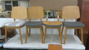 A set of four modern oak dining chairs Location: