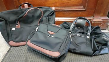 Three Samsonite suitcases comprising a black and grey holdall 24" wide, another 19" wide and one 16"