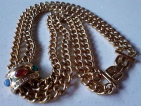 Givenchy-A late 20th Century gold tone dual open chain necklace having a pendant with red, blue