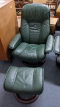 A Ekornes stressless green teacher armchair with matching footstool Location: