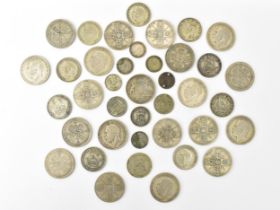 A collection of pre 1947 British coinage to include George V and VI Florins (9) Shillings (10),