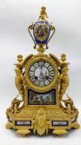 A 19th century French gilt bronze mantle clock, the case having Sevres style porcelain panels, urn