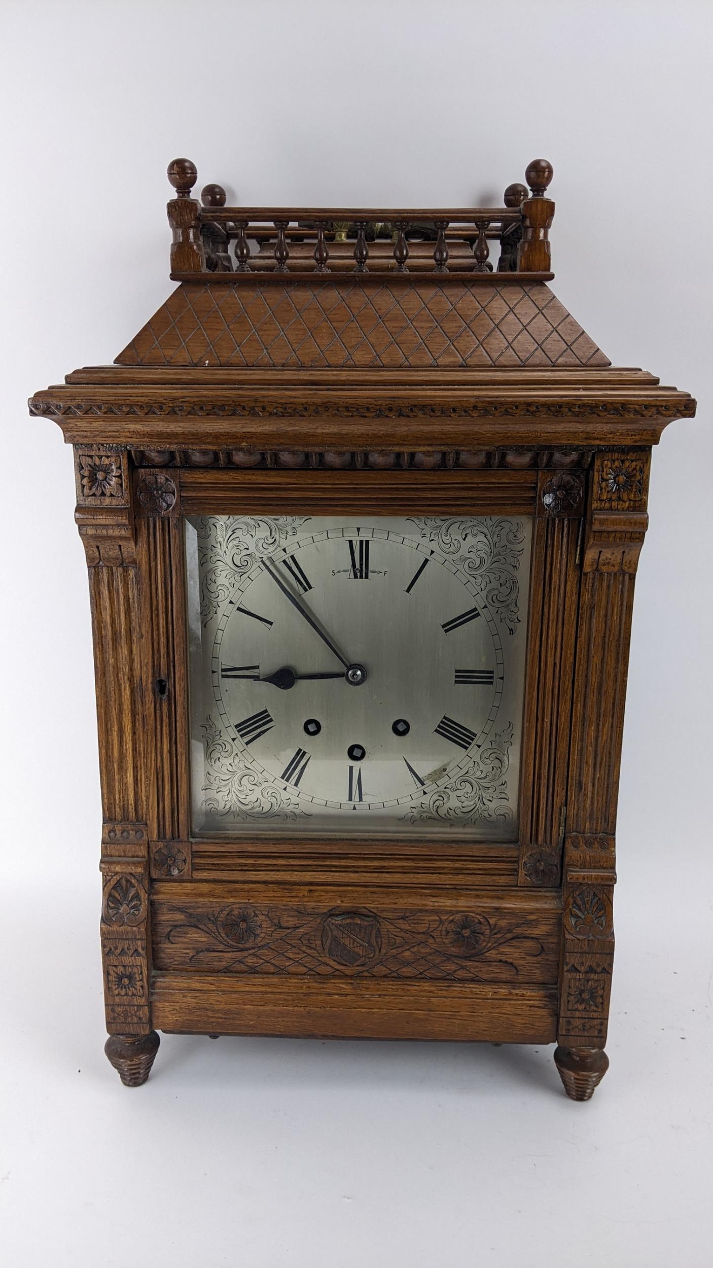 A late 19th century oak bracket clock, the case of architectural design having a handle to the top - Image 3 of 9