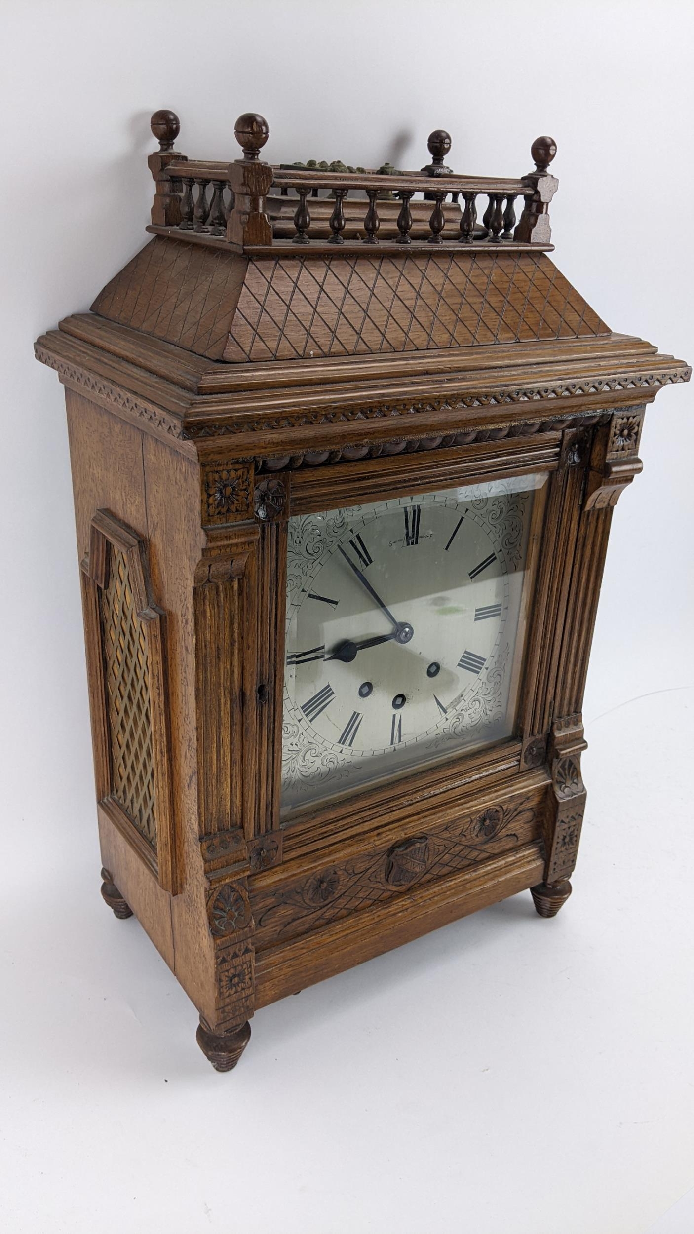 A late 19th century oak bracket clock, the case of architectural design having a handle to the top - Image 6 of 9