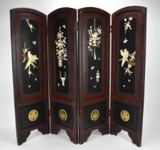 A Japanese lacquer, bone and mother-of-pearl inlaid four-fold screen, circa 1900, each arched