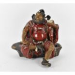A large 20th century Chinese shiwan glazed pottery model of Zhong Kui by Liu Zemian, in a seated