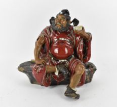 A large 20th century Chinese shiwan glazed pottery model of Zhong Kui by Liu Zemian, in a seated