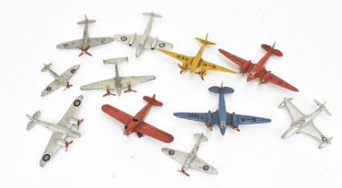 A small collection of Dinky Toys aircraft to include a Light Racer in yellow, two Light Transport in
