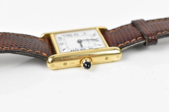 A Cartier Tank, manual wind, ladies, 18ct gold wristwatch, having a white dial with Roman numerals, - Image 4 of 5