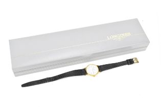 A Longines, quartz, ladies, 18ct gold wristwatch, having a white dial with centre seconds and