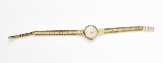 A Tudor, manual wind, ladies, 9ct gold wristwatch, having a white dial, baton markers, Rolex crown