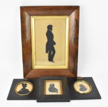 A collection of 19th century silhouettes, comprising a lady, two gentlemen, with gilt highlights