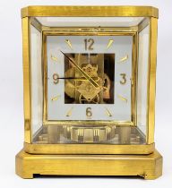 A Jaeger Le Coultre Atmos clock circa 1960s, in a gilt brass case, having a square cream chapter